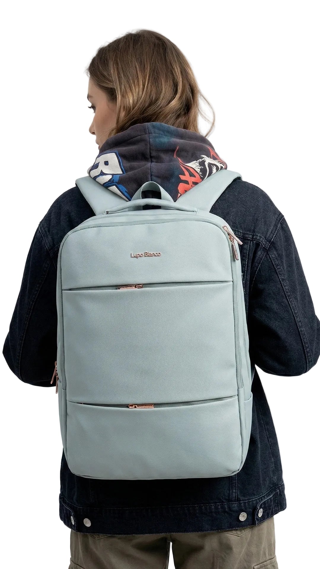 Person wearing a light gray backpack with a visible brand logo on a white background