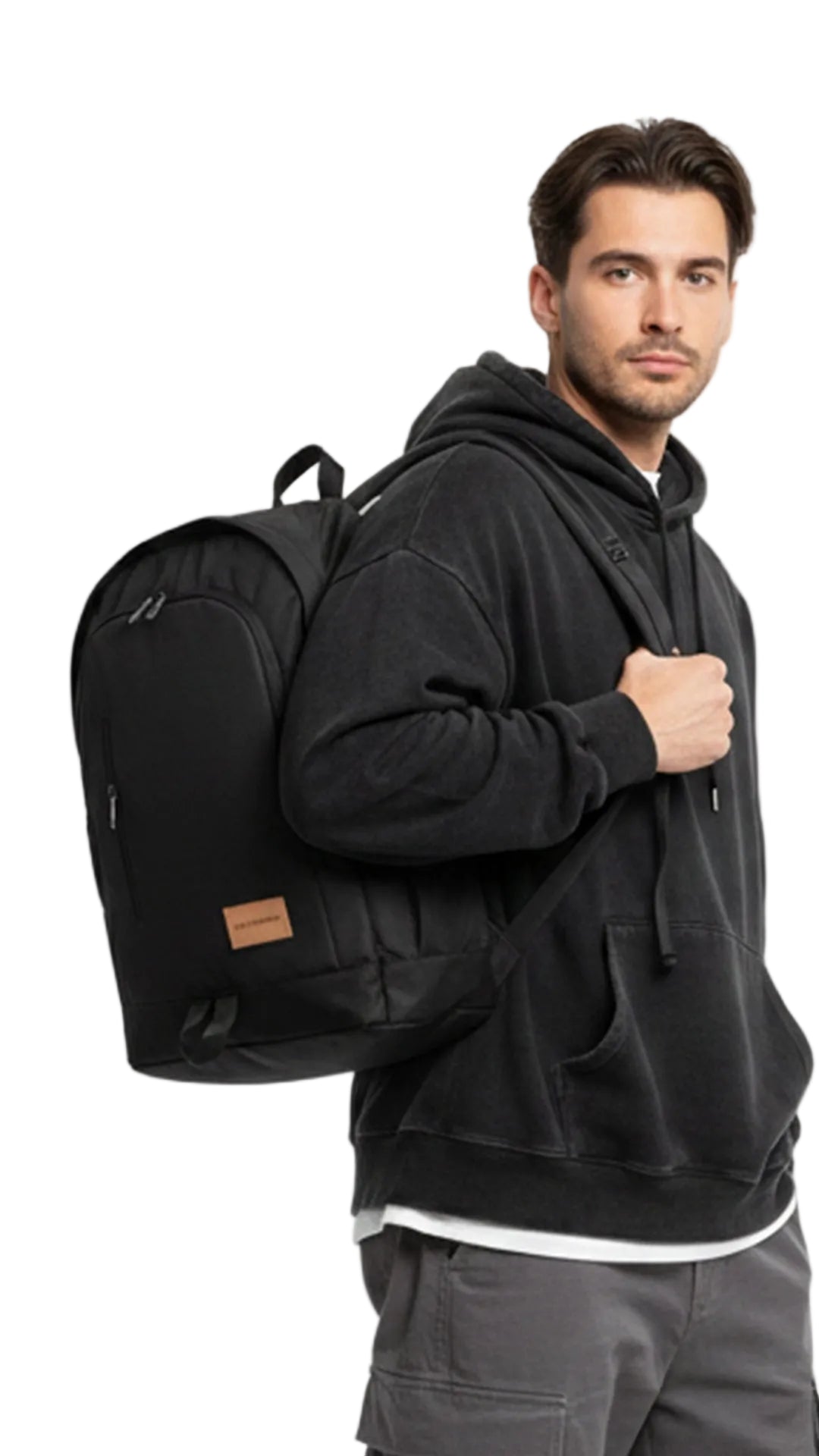 Man wearing a black hoodie and carrying a black backpack on a white background